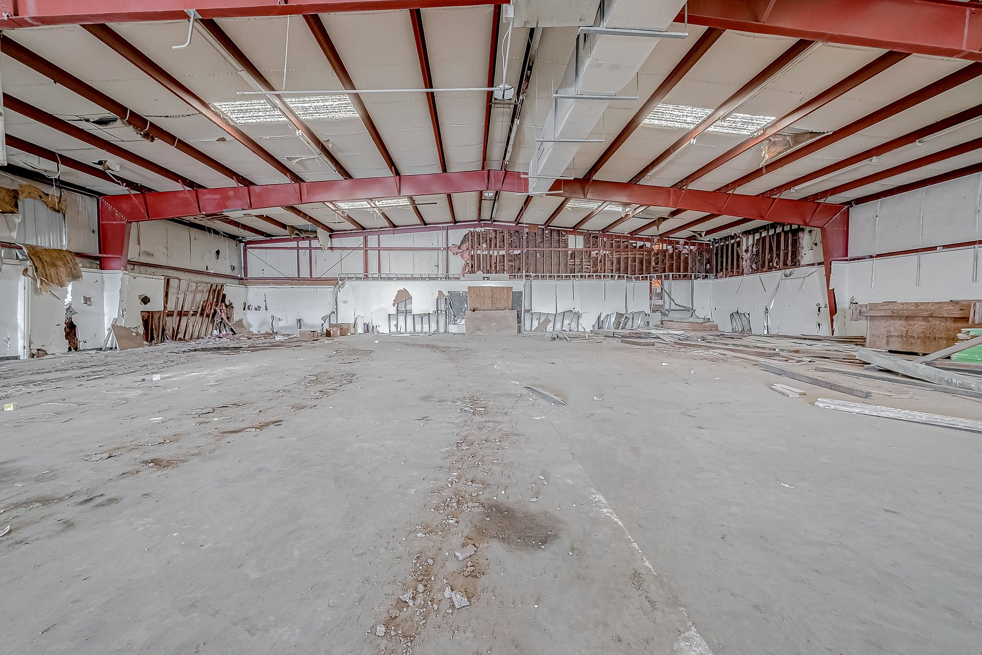 3600 Harrisburg today — Gutted to the steel → finished storefront